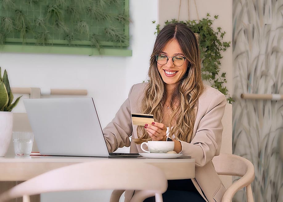 A businesswoman making digital payments with her credit card. — Sanja Miljevic // Shutterstock