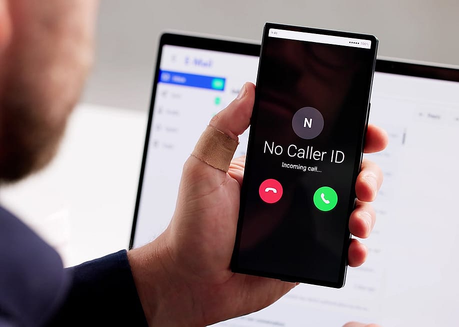 An identity theft investigator tracks an unknown number calling and possibly hacking a smartphone. — Andrey_Popov // Shutterstock