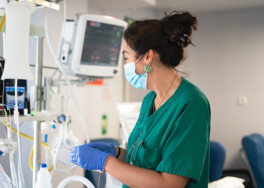 An ICU nurse working with medical monitors. — killa1 // Shutterstock