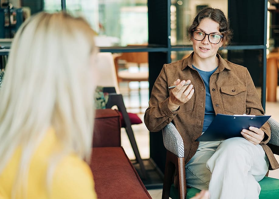A psychologist advising a patient during a therapy session. — Ilona Kozhevnikova // Shutterstock