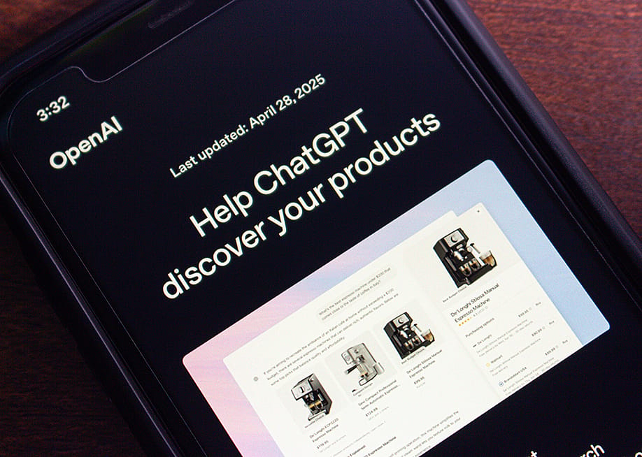 Close-up of a smartphone screen showing OpenAI's website with the ‘Help ChatGPT discover your products’ page. — Koshiro K // Shutterstock