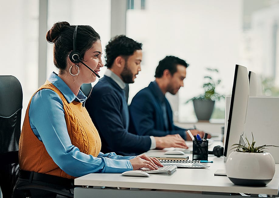A call center employee talking with a customer over a call for solution support. — PeopleImages // Shutterstock