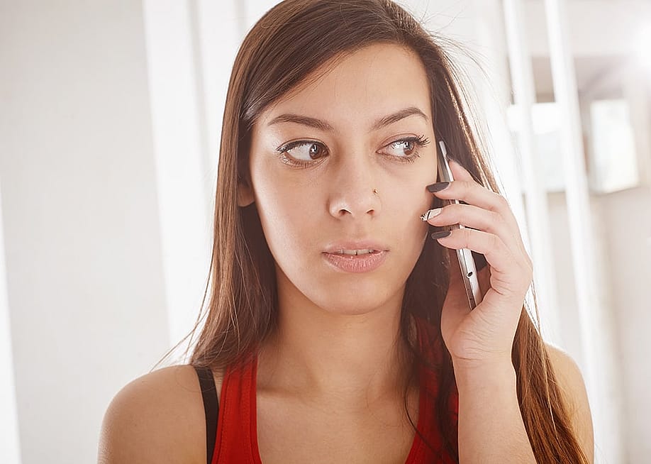 A person talking to someone over her smartphone. — shyshak roman // Shutterstock
