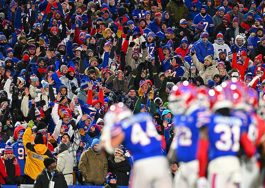 Buffalo Bills fans celebrating through an audience wave during the third quarter game against the New York Jets at Highmark Stadium in New York, USA. — Jason Miller // Getty Images