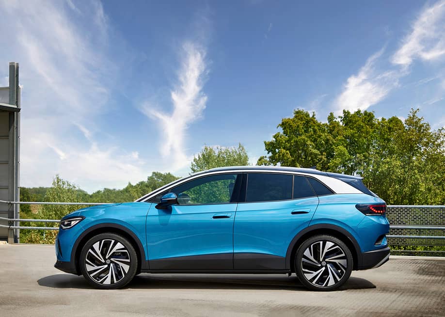 A Volkswagen ID.4, an electric crossover SUV parked in a home garage. — Volkswagen AG