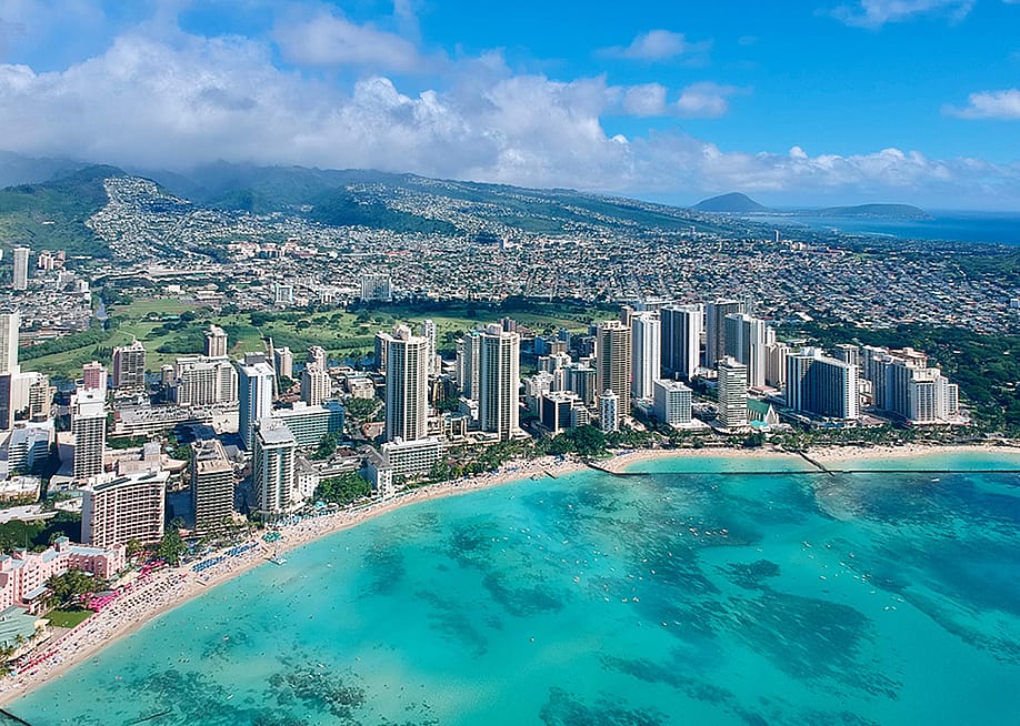 An aerial photo of Honolulu, Hawaii's coast and skyline. — Novel Alam // Shutterstock