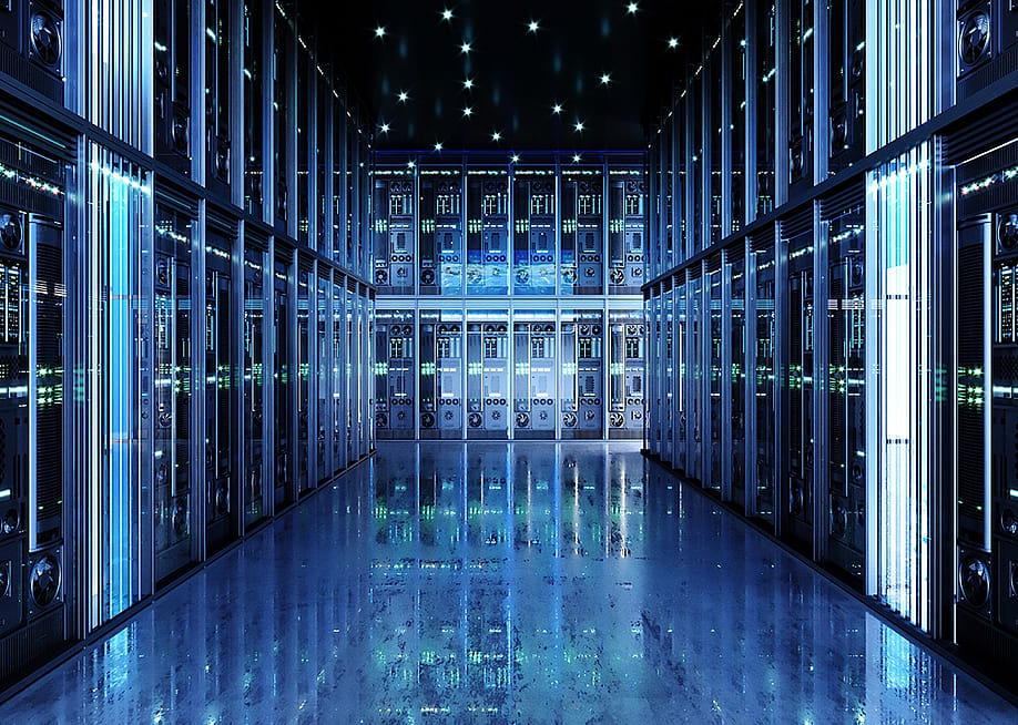 Interior of a data center showing a hall of server packs. — denisik11 // Shutterstock