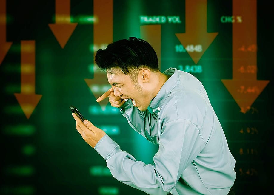 A stock investor frustrated over market crash. — Creativa Images // Shutterstock