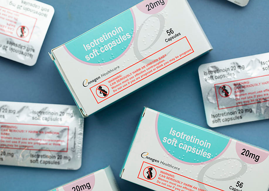 Packs of Isotretinoin or Roaccutane tablets for severe acne medications. — Ink Drop // Shutterstock