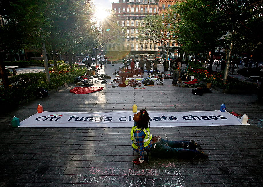 An environmental activist protesting outside CitiBank Headquarters in New York City, USA. — LEONARDO MUNOZ // AFP via Getty Images