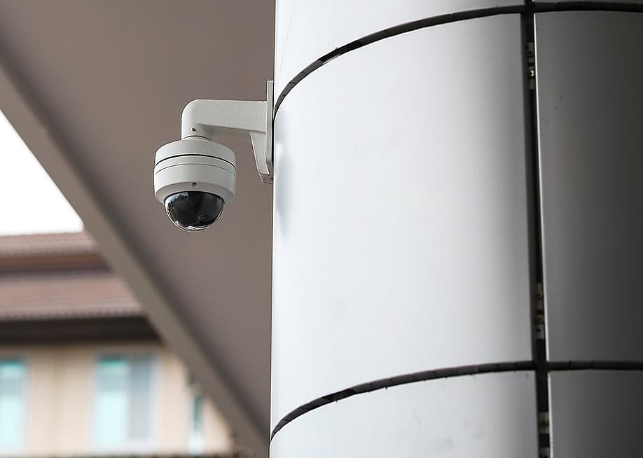 An outdoor CCTV within a school building. — Titikul_B // Shutterstock