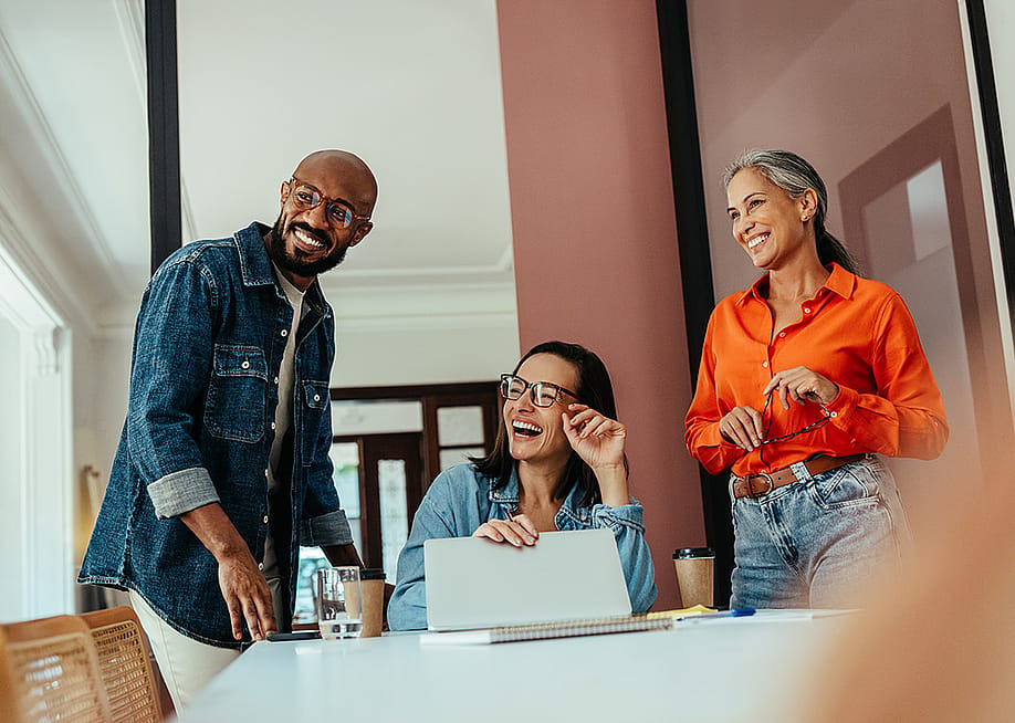 A business team enjoying collaboration in an office. — JLco Julia Amaral // Shutterstock