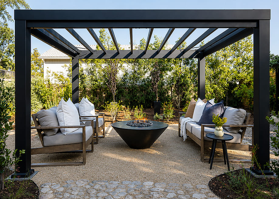 A modern black aluminum pergola structure with a contemporary outdoor lounge area. — Grand Canyon Gas Logs