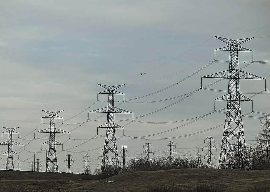 Electric poles and power lines seen in South-East area of Edmonton, Alberta, Canada. — Artur Widak // NurPhoto via Getty Images