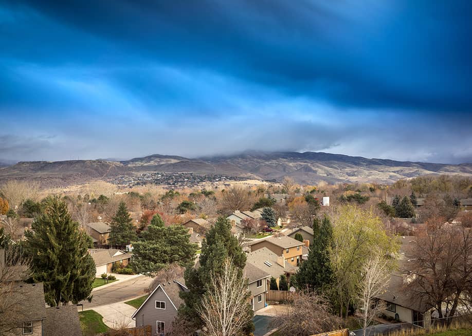 Aerial view of residential homes among the rocky mountains in Boise, Idaho. — Paul W Thompson // Shutterstock