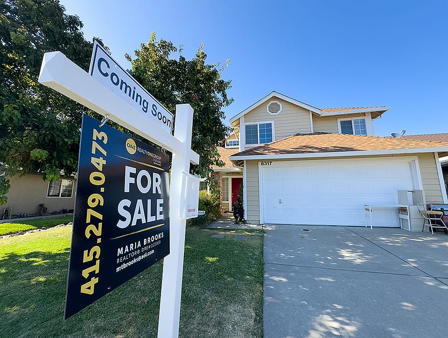 A 2-story suburban home for sale. — ZikG // Shutterstock