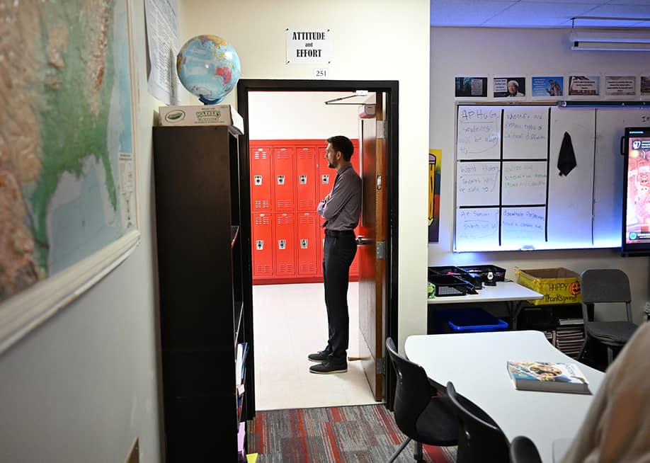 Adam Gravenor waiting for his students on his world history class at Coronado High School in Colorado, USA. — RJ Sangosti // MediaNews Group / The Denver Post via Getty Images