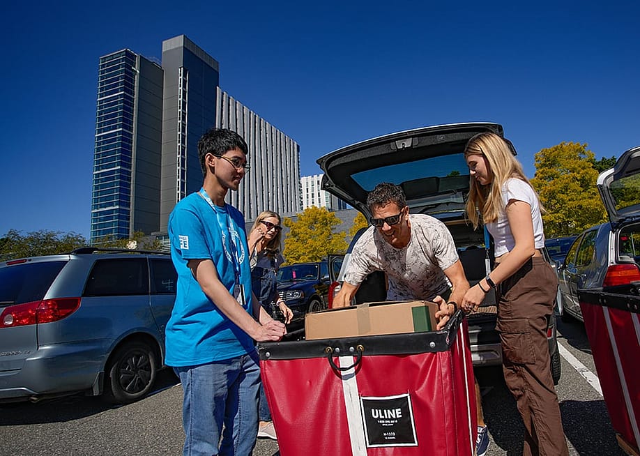 Students arriving at the University of British Columbia for Move-In Day in the campus in Vancouver, Canada. — Harrison Ha // Shutterstock