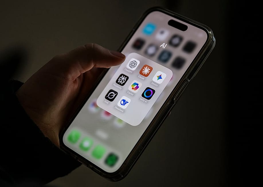 Different AI applications displayed from a smartphone's screen, from ChatGPT, Claude, Gemini, Perplexity, Microsoft Copilot, Meta AI, Grok to DeepSeek. — Philip Dulian // picture alliance via Getty Images