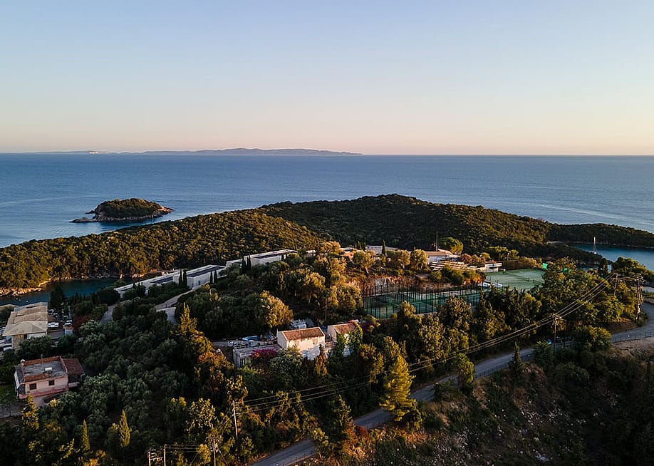 An aerial view of high-end residential houses in an island town of Syvota, Greece. — Nenad Cavoski // Shutterstock