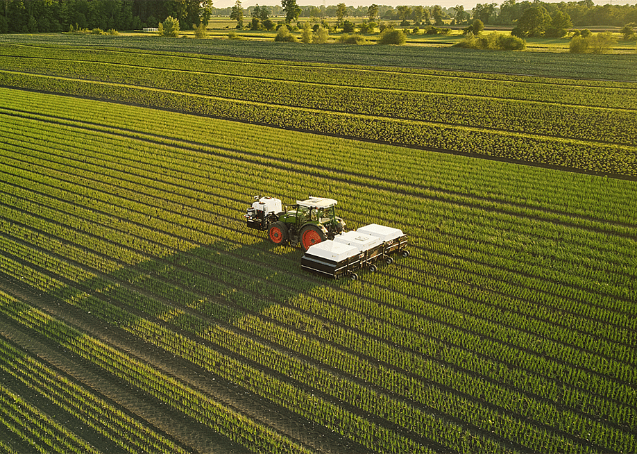 Aerial view of Ecorobotix machine working in a green field. — Ecorobotix
