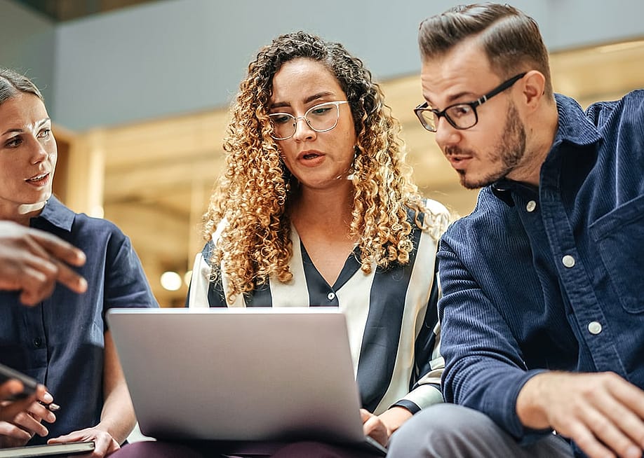 Business managers discussing creative options for their startup in a meeting room. — Gorodenkoff // Shutterstock