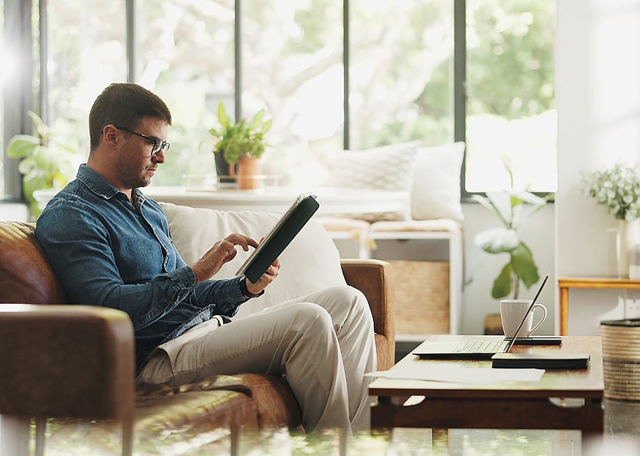 An account manager working on a client portfolio and research before an online meeting at home. — PeopleImages // Shutterstock