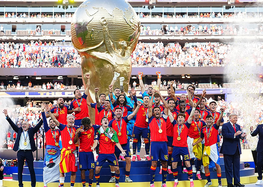 Rodri of Spain celebrates by lifting the FIFA World Cup trophy with teammates. — Evrim Aydin // Anadolu via Getty Images