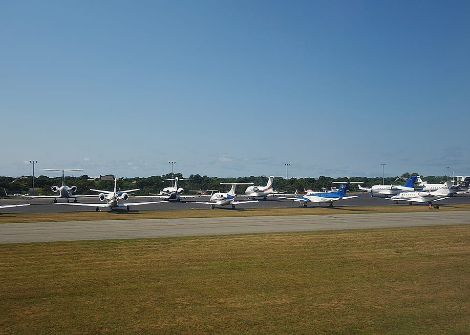 Private jets parked at Nantucket island's memorial airport in Massachusetts, USA. — EQRoy // Shutterstock