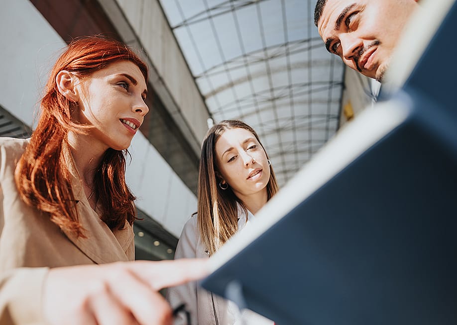 A business finance team discussing profitability and tax rates updates of a corporation. — Gorgev // Shutterstock
