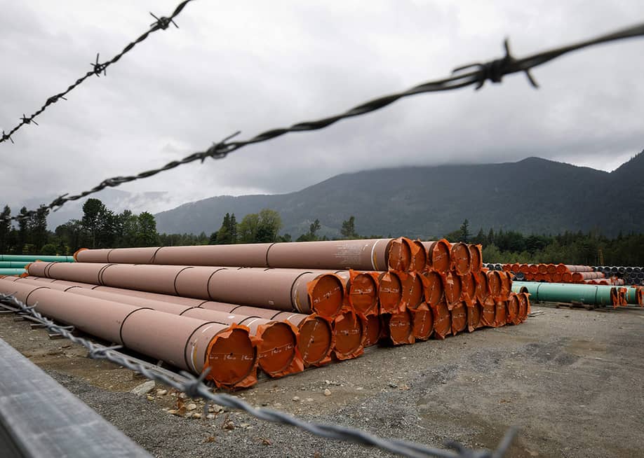 Pieces of the Trans Mountain Pipeline project sit in a storage lot outside of Hope, British Columbia, Canada. — COLE BURSTON // AFP via Getty Images