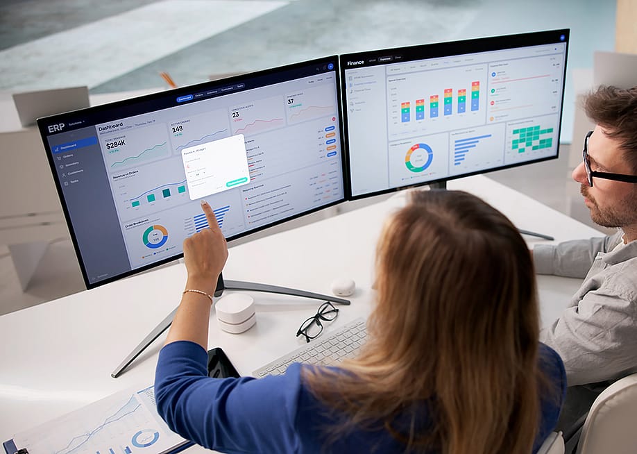 Corporate analysts reviewing a dashboard of an enterprise resource planning (ERP) software in preparation for an accounts payable policy. — Andrey_Popov // Shutterstock