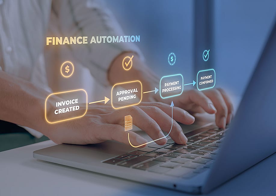 A person types on a laptop keyboard illustrated with finance automation software graphics. — Iftekhar Emon // Shutterstock