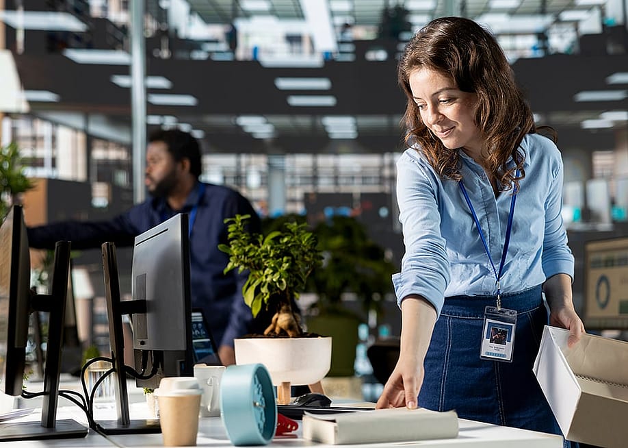 A new office employee setting up her work station. — DC Studio // Shutterstock
