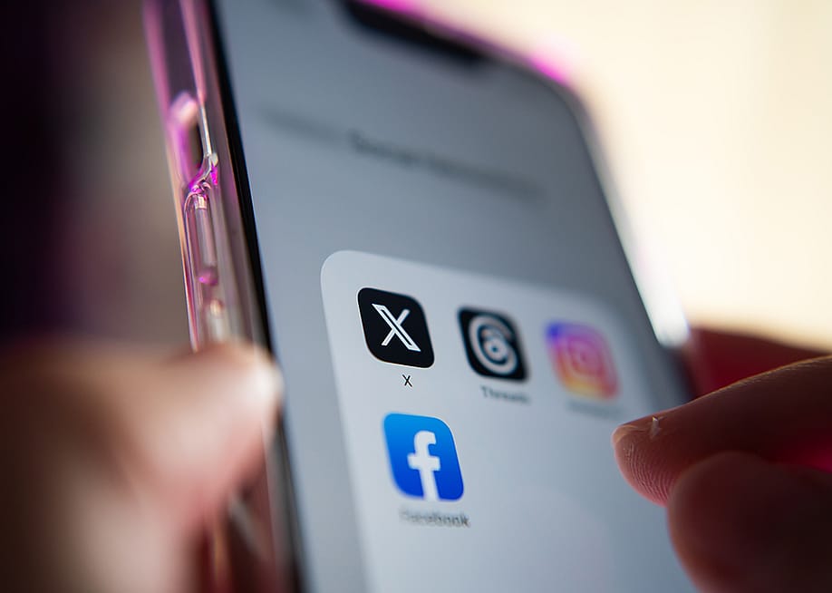A mobile phone showing social media apps. — Wachiwit // Shutterstock