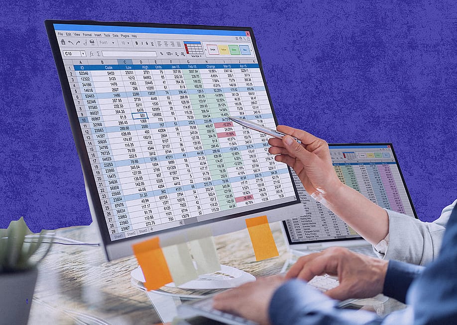 Analysts reviewing spreadsheets from separate monitors for financial tracking and data management tasks. — Madeline Stone // Stacker