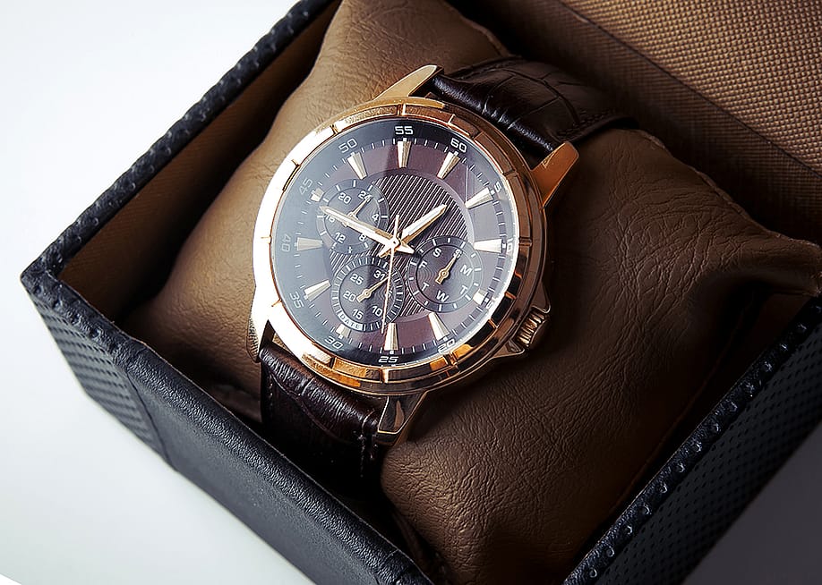 A luxury men's wristwatch in bronze and black leather colorway. — Kuznechik // Shutterstock