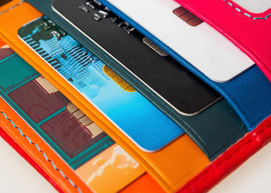 A collection of credit cards inside a wallet. — daniiD // Shutterstock