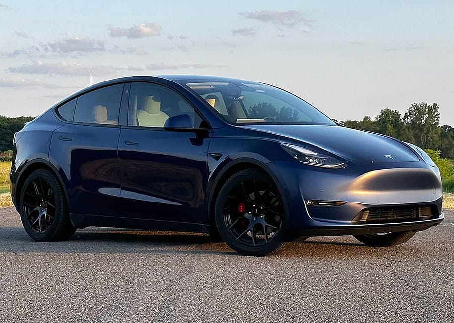 Black 2023 Tesla Model Y front three-quarter view. — Sebastian Blanco // Capital One