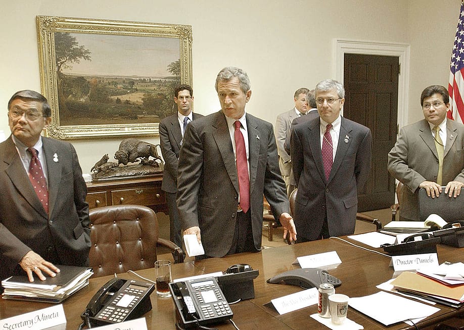 Former US President George W. Bush (2L) meeting with Transportation Secy. Norman Mineta (L), Deputy Chief of Staff Josh Bolten (2R) & WH Counsel Al Gonzalez. — Greg Mathieson // MAI Photo News Agency via Getty Images