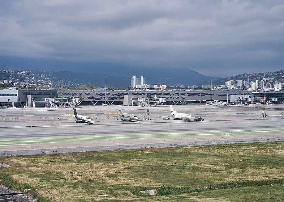 A view of private jet planes seen at the Nice Côte d'Azur airport in France. — Khun Ta // Shutterstock