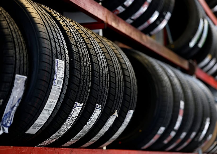 New tires displayed on a rack. — Justin Sullivan // Getty Images