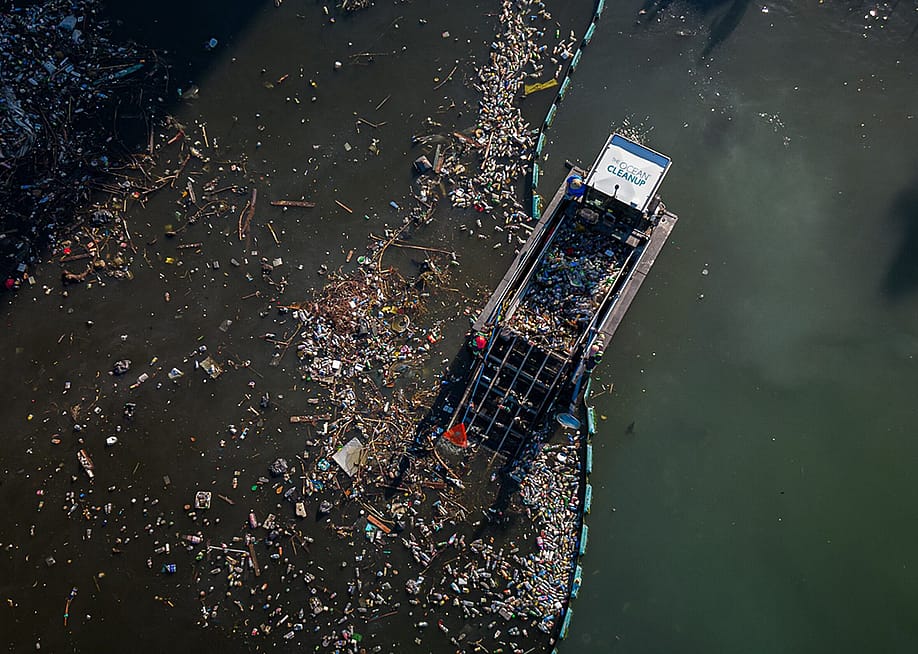 Aerial view of an interceptor by The Ocean Cleanup collecting trash from the ocean. — Courtesy of The Ocean Cleanup