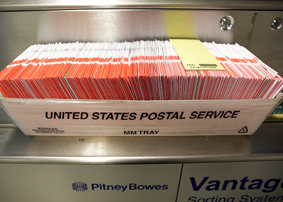 Ballots seen in a US Postal Service box on Election Day at the King County Elections office in Renton, Washington, USA. — JASON REDMOND // AFP via Getty Images