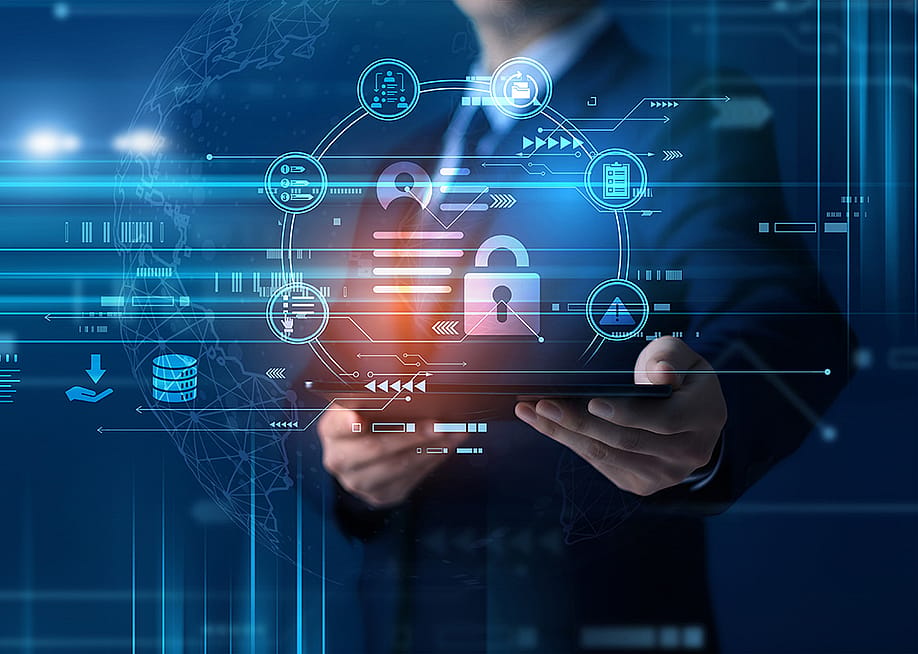 A conceptual graphic of cyber security, featuring a person holding a tablet with a digital padlock and data protection holograms. — HM TECH Creations // Shutterstock
