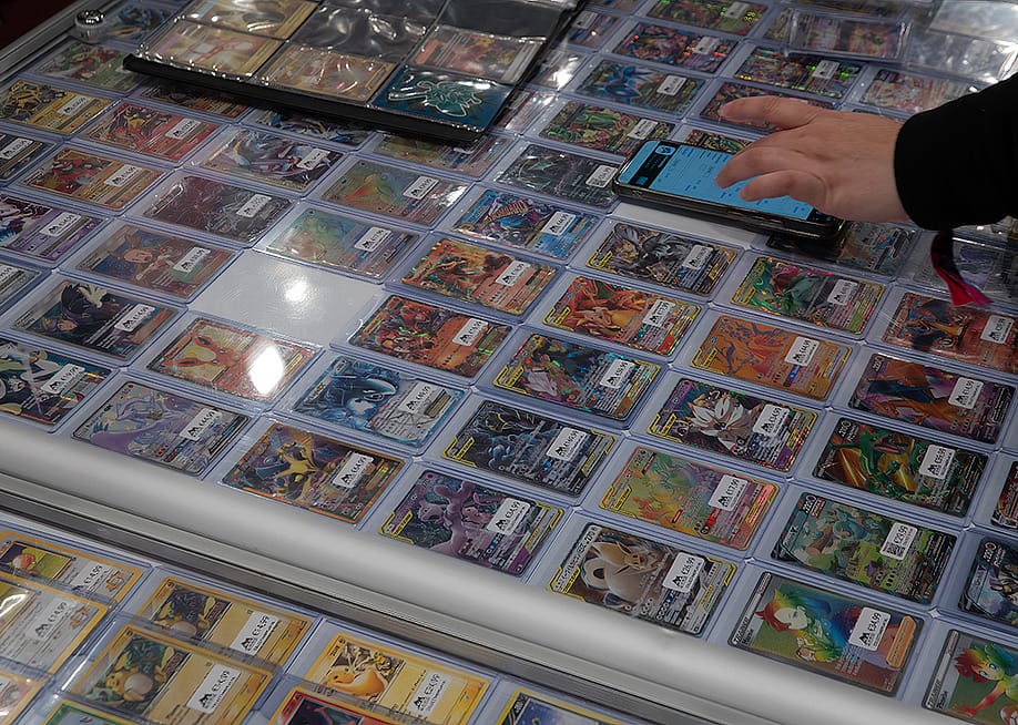 A game trader selling various Pokémon cards at the 2025 Heroes Dutch Comic Con Congress held in Utrecht, Netherlands. — Dutchmen Photography // Shutterstock