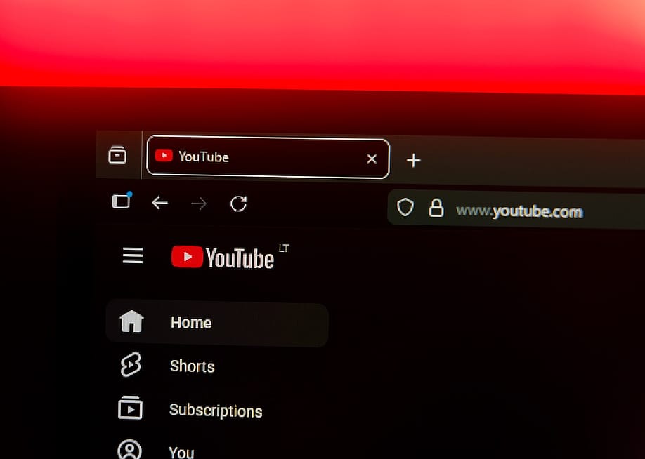 Close up on a web browser displaying the YouTube logo and home menu. — Rokas Tenys // Shutterstock