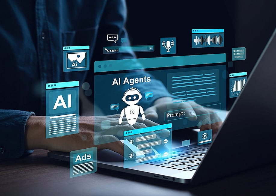A businessman using a laptop with futuristic software as a concept of navigating a role with agentic AI. — chayanuphol // Shutterstock