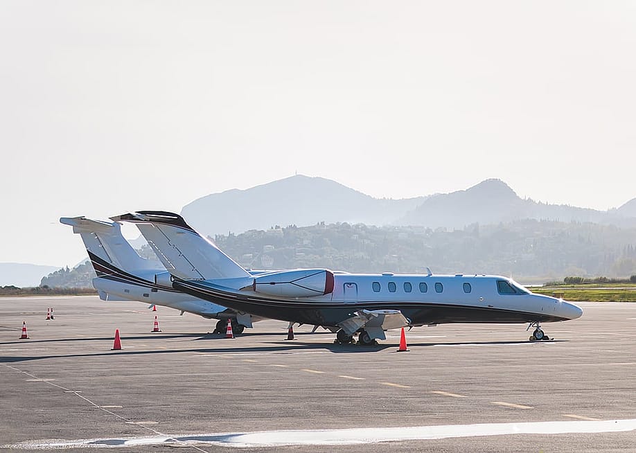 View of modern private reactive aircraft on an runway airfield ready to take off. — Tsuguliev // Shutterstock