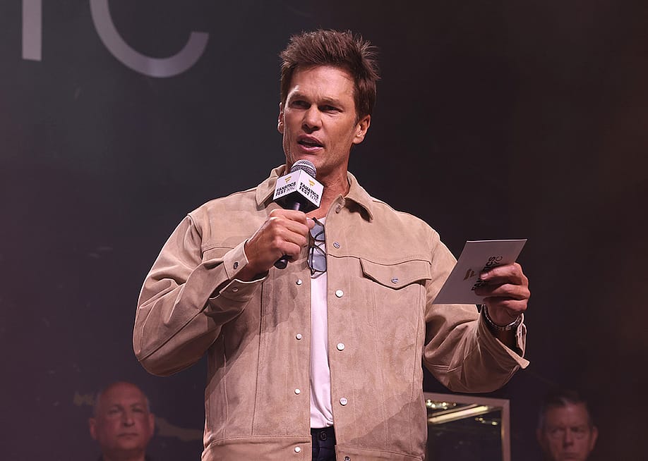 Tom Brady speaking onstage during the Fanatics Fest NYC 2026 at Jacob Javits Center in New York City, USA. — Rob Kim // Getty Images for Fanatics